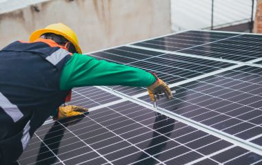 solar technician installing solar panel